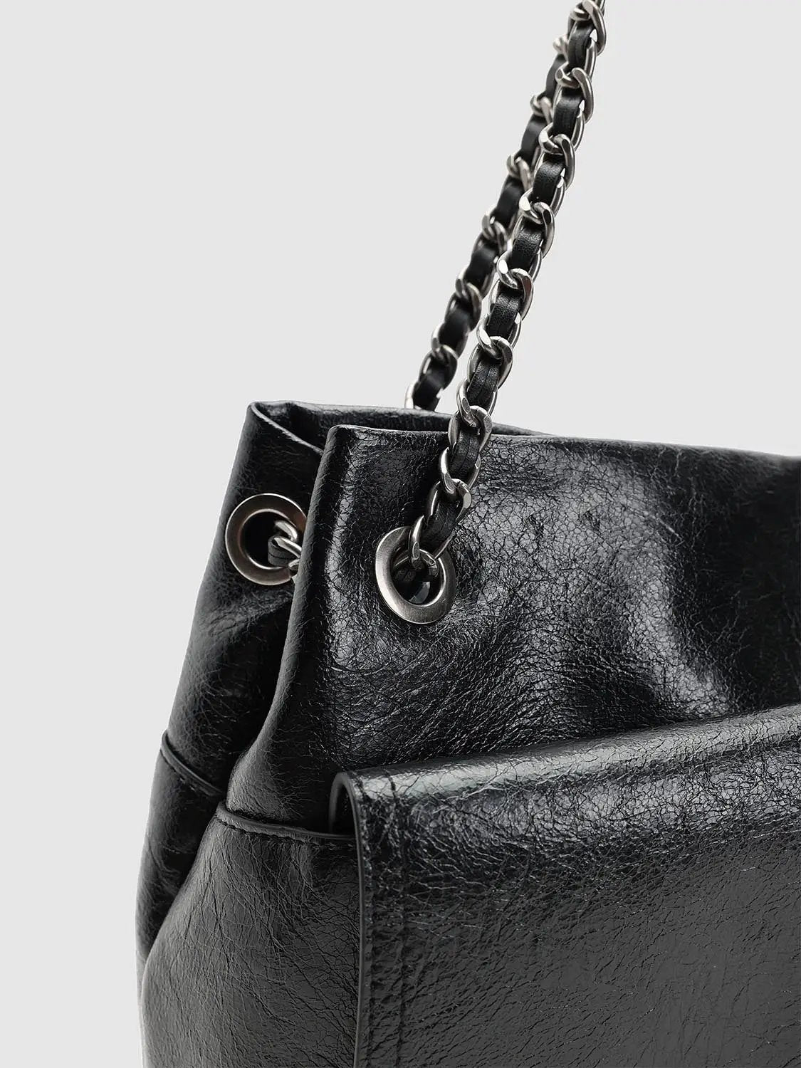 Chain Hardware Large Capacity Faux Leather Shoulder Bag by Urban Revivo Fashion, black with metal chain strap.