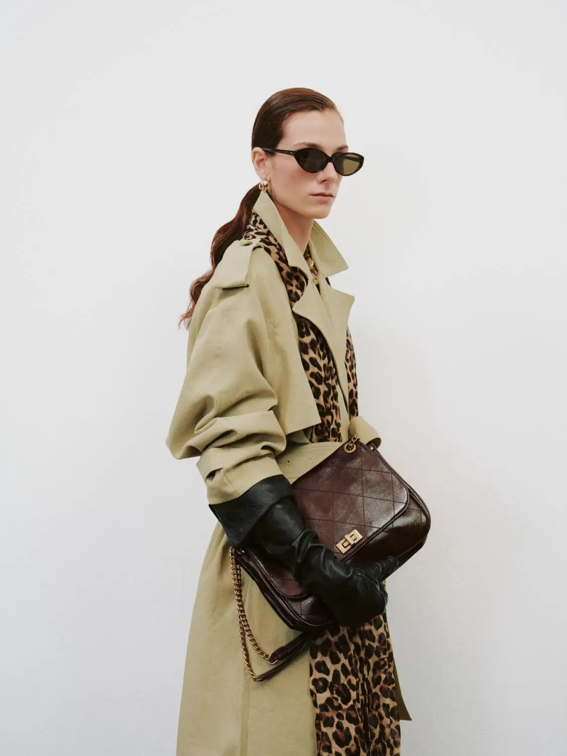 Shoulder & crossbody bag in brown quilted leather with gold hardware.