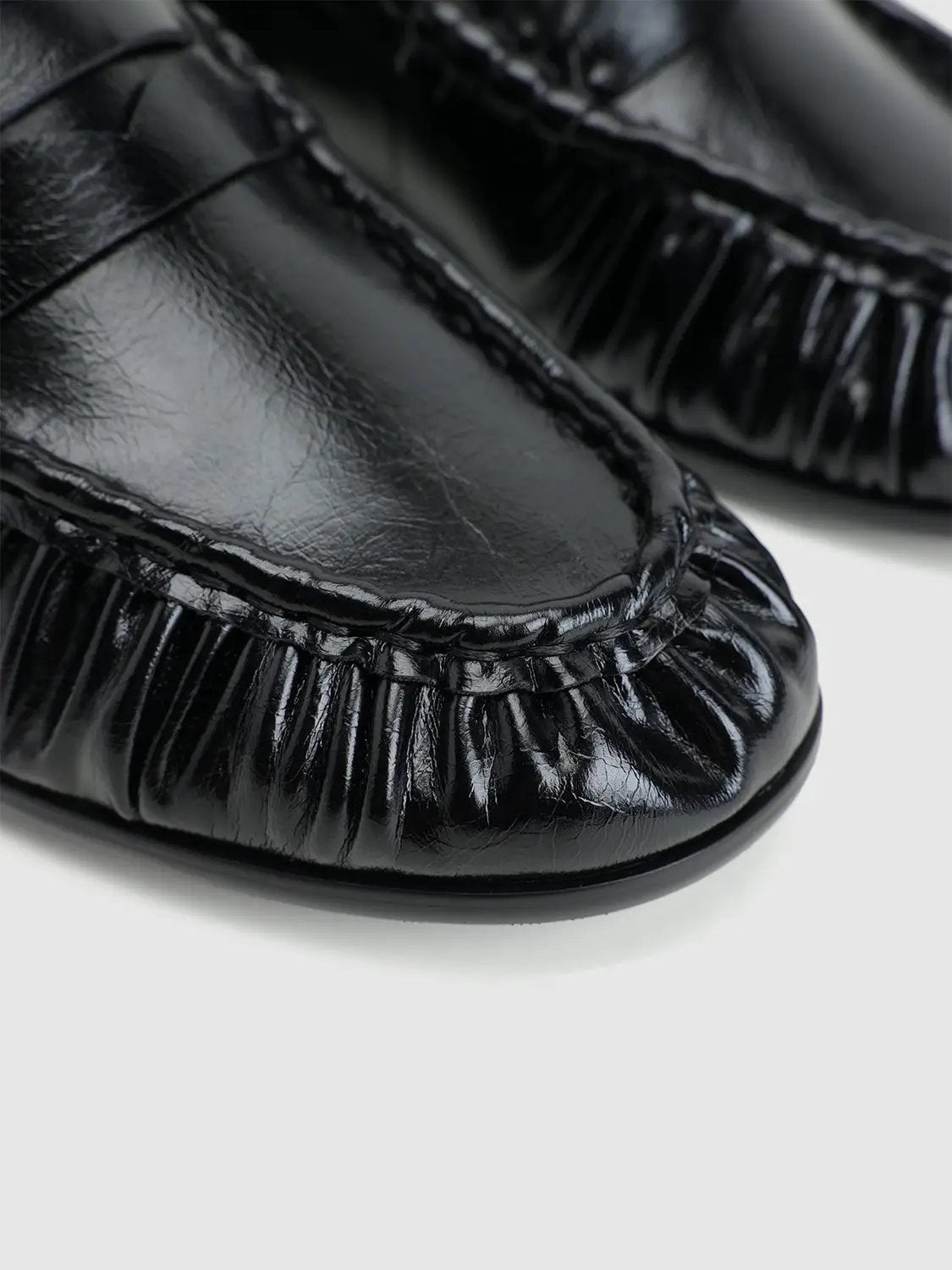 Pumps, black patent leather with gathered elastic trim, close-up toe