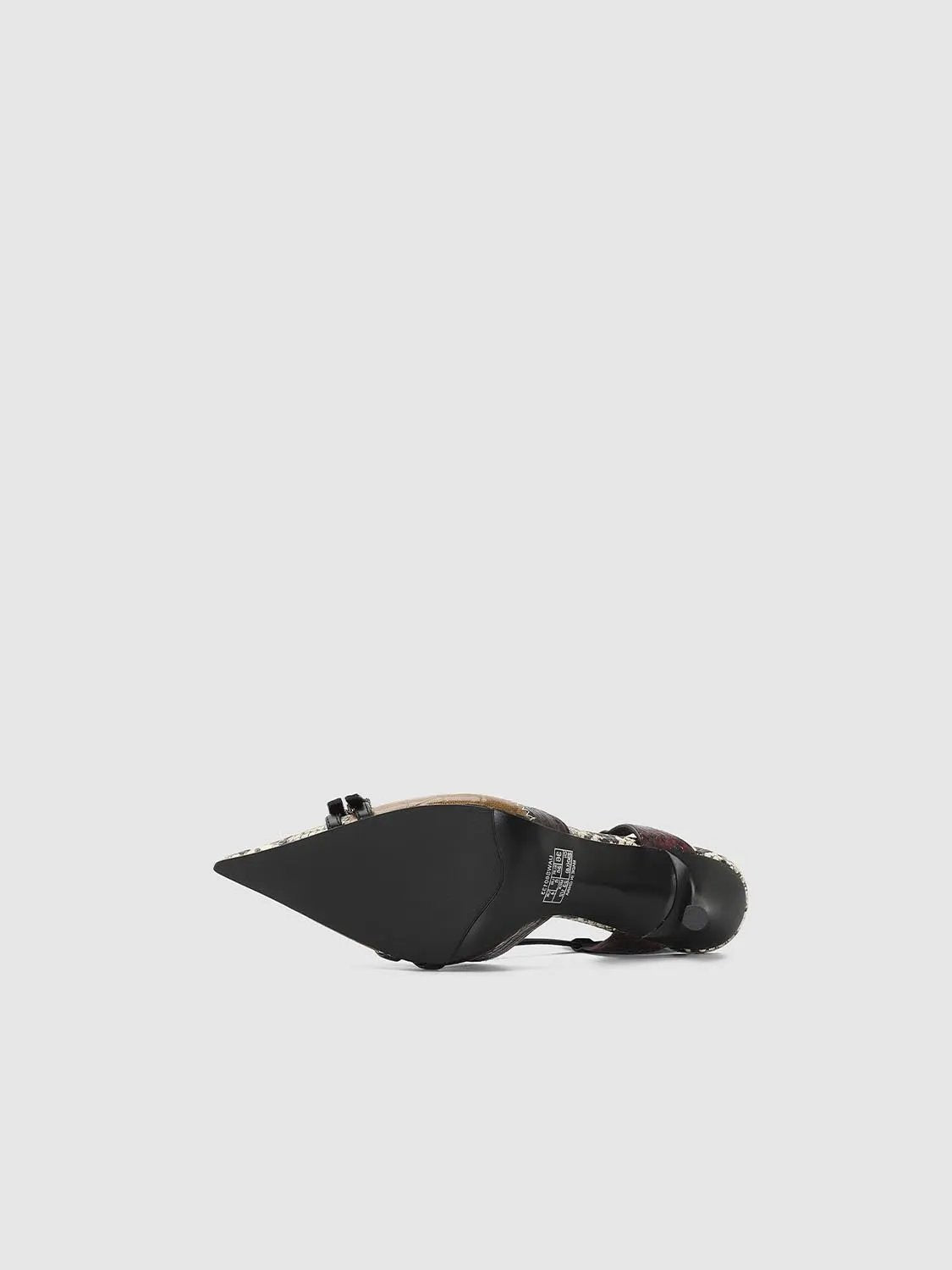 Empty Shoes slingbacks with black pointed toe and patterned trim on the upper.
