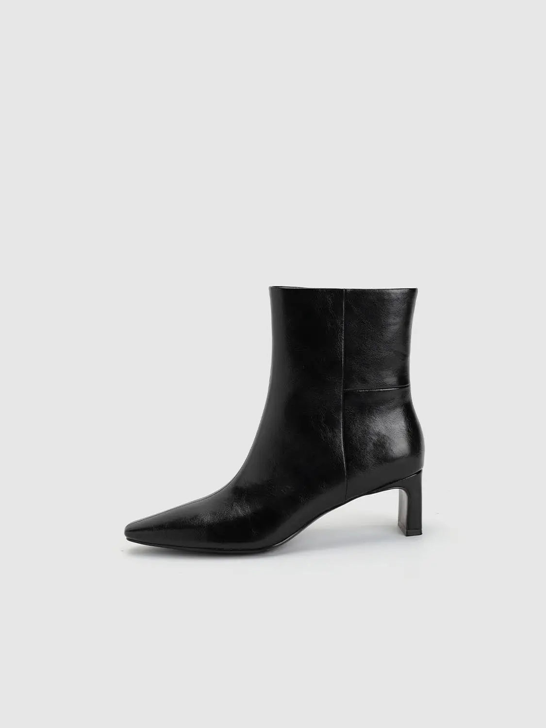 Boots black leather ankle boot with pointed toe and mid-height block heel.