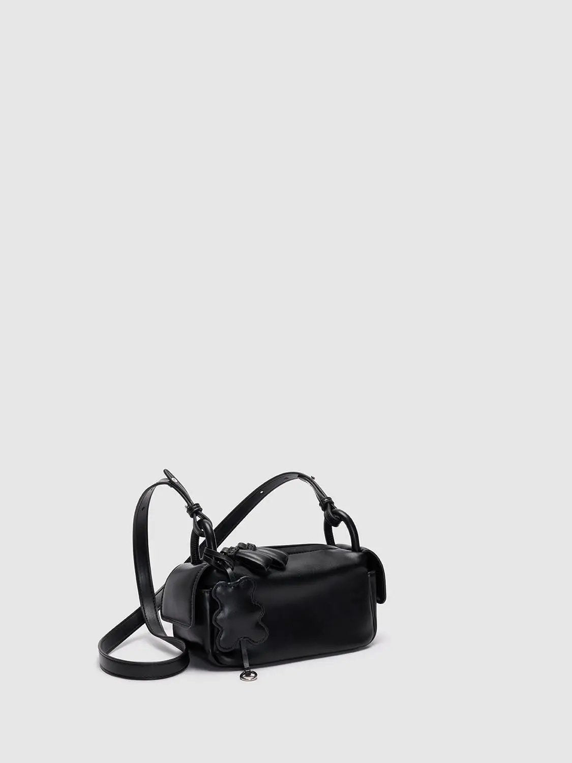 Top Handle & Crossbody Bag in black leather with long strap and decorative flower patch