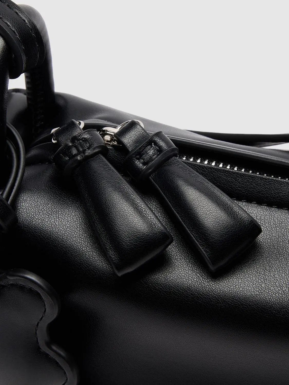 Top Handle & Crossbody Bag in black leather with metal hardware.