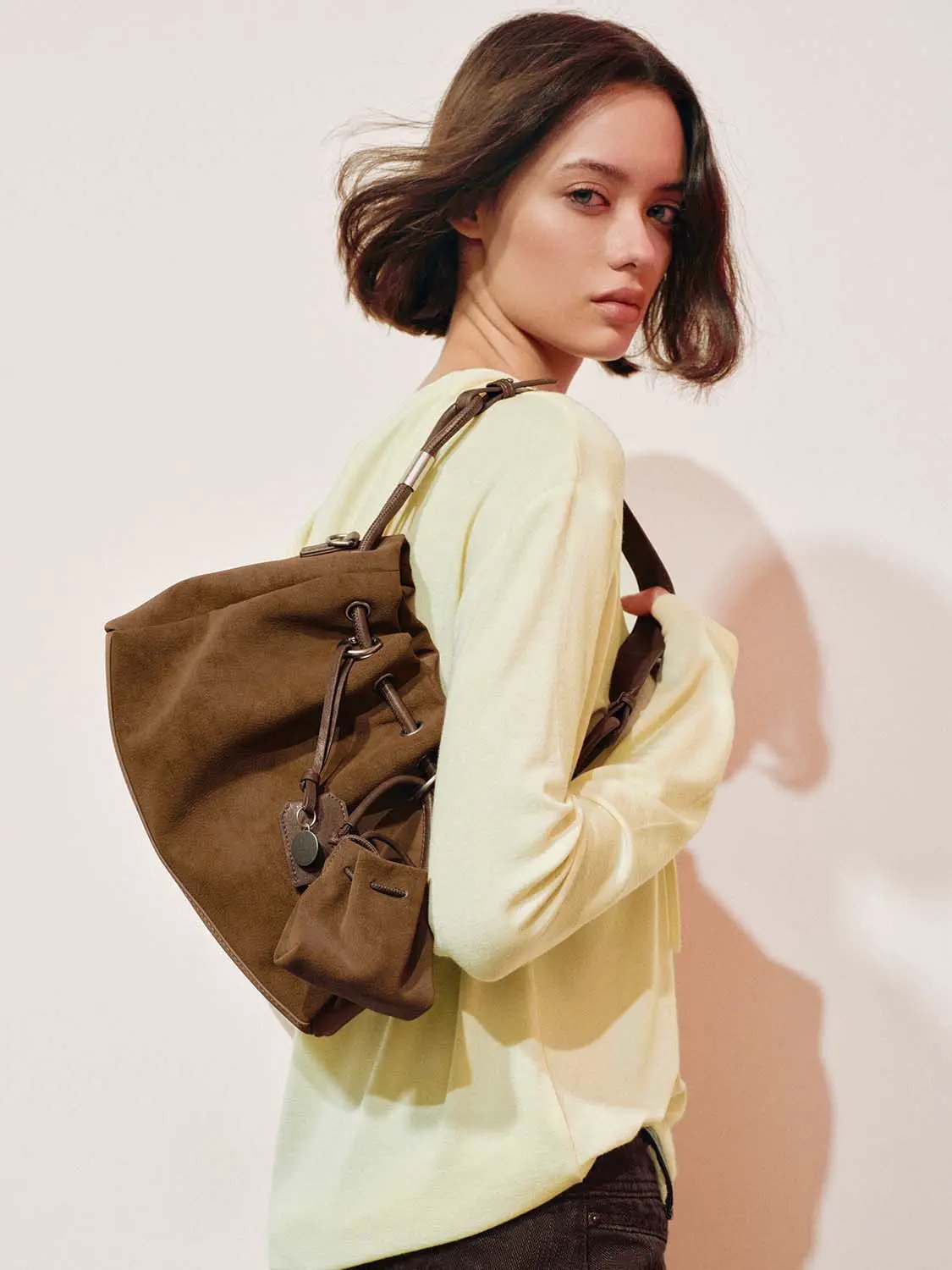 Shoulder & Crossbody Bag in brown suede with exterior pockets and adjustable strap
