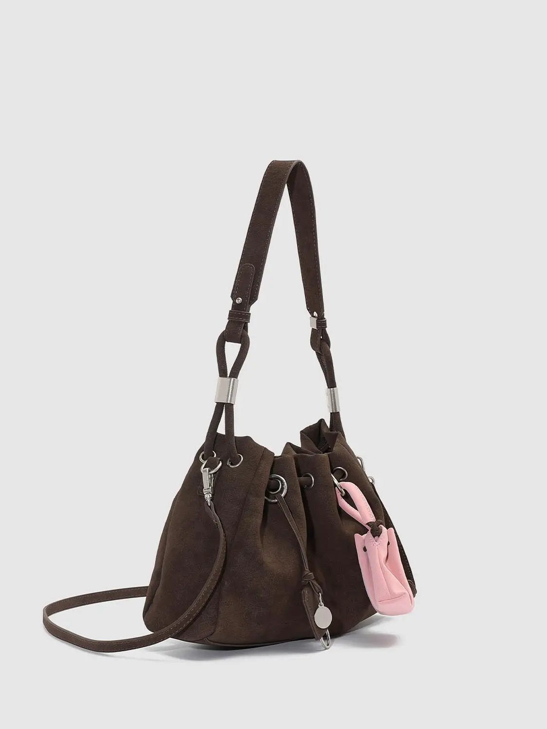 Shoulder and crossbody bag by Urban Revivo Fashion in dark brown suede with pink mini pouch.