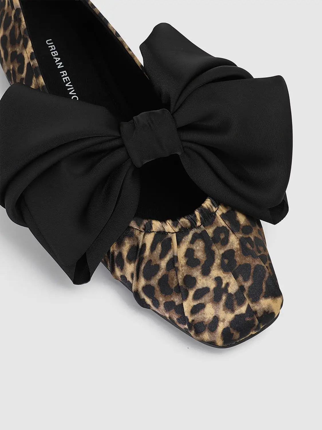 Leopard-print flats by Urban Revivo with a bold black bow