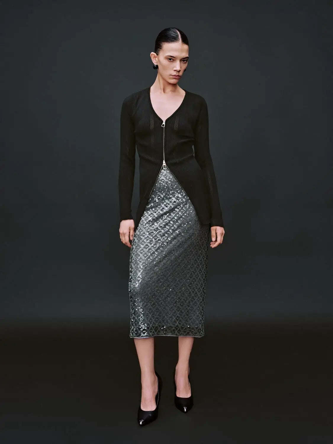 Zip Up Front Knitted Cardigans in black, paired with a silver sequin midi skirt, two-piece outfit.