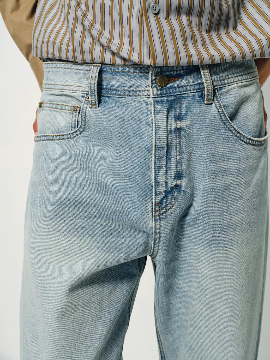 Jeans, light-wash denim with belt loops and front pockets.