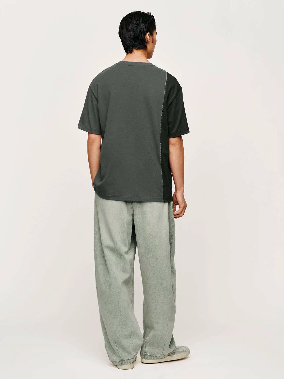 Urban Revivo Fashion denim jeans in light grey, loose fit, back view.