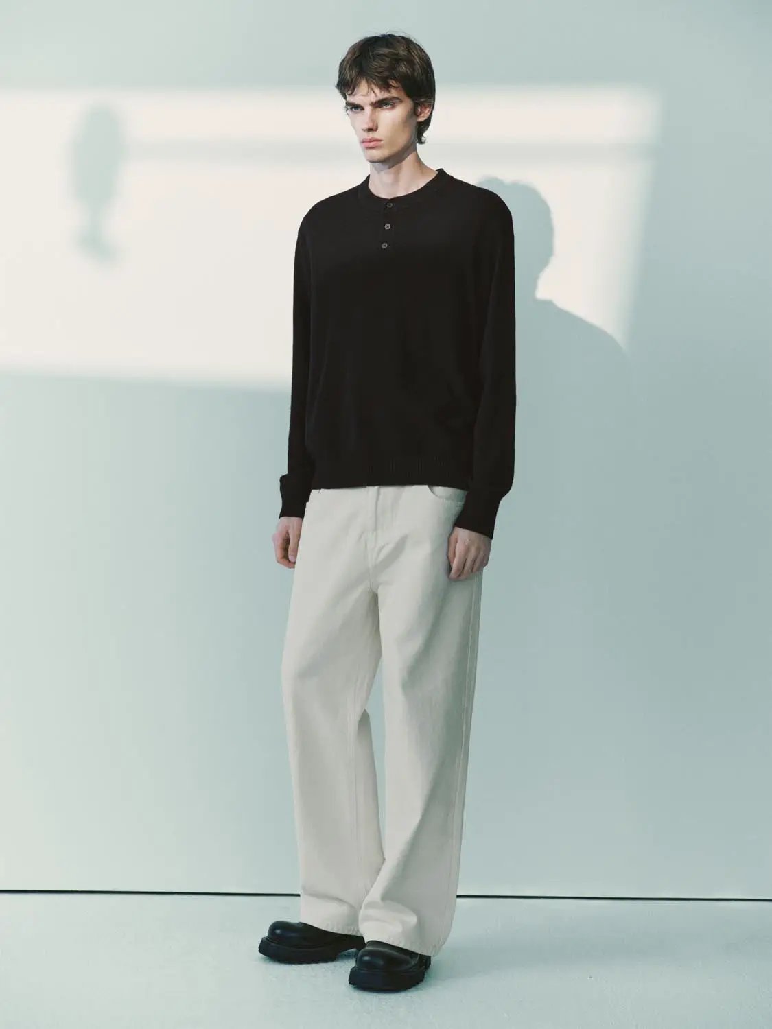 Knit T-Shirt by Urban Revivo Fashion, black long-sleeve knit top on male model