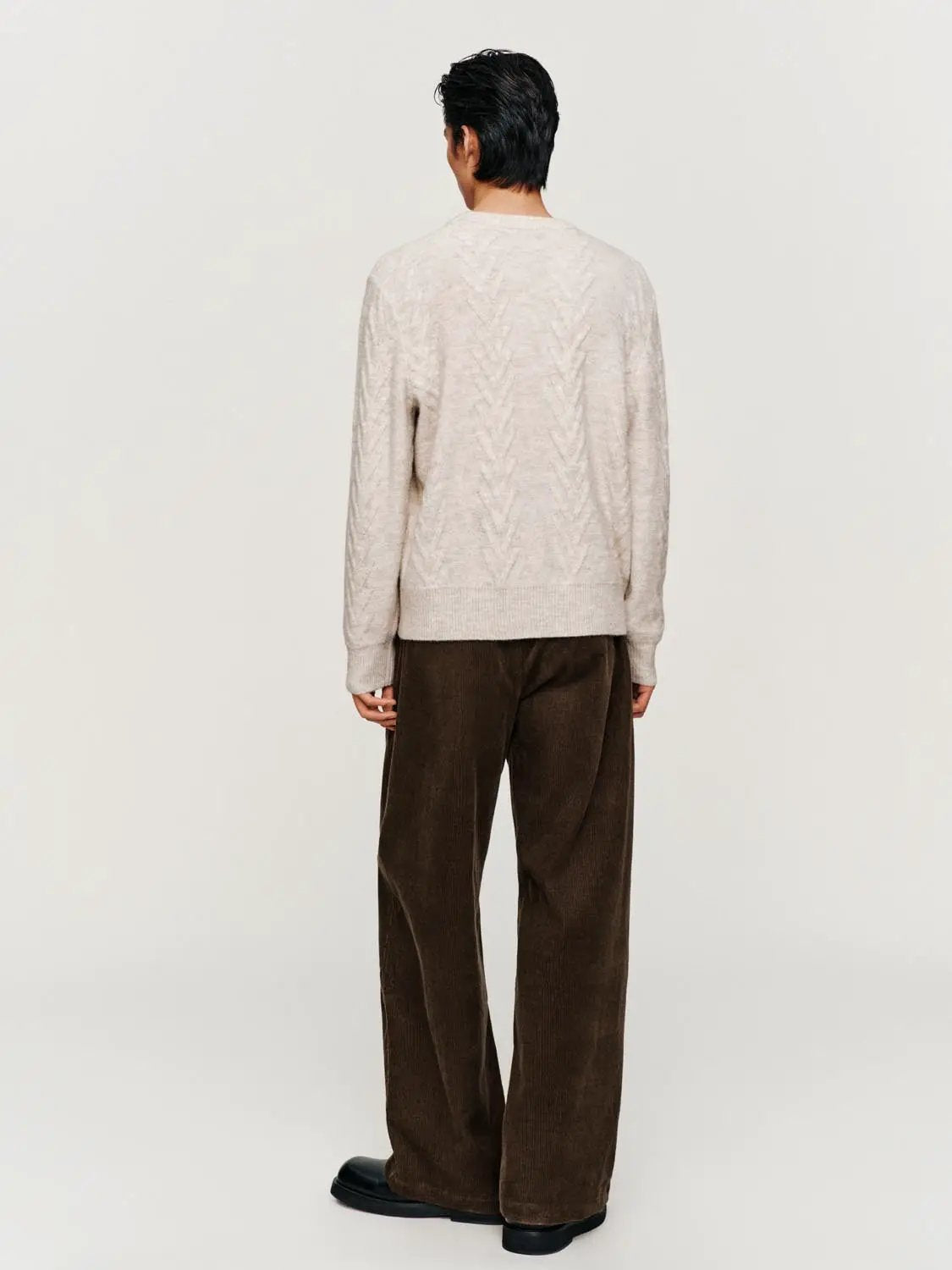 Knit top in beige oatmeal with chevron knit pattern; back view, long-sleeve sweater.