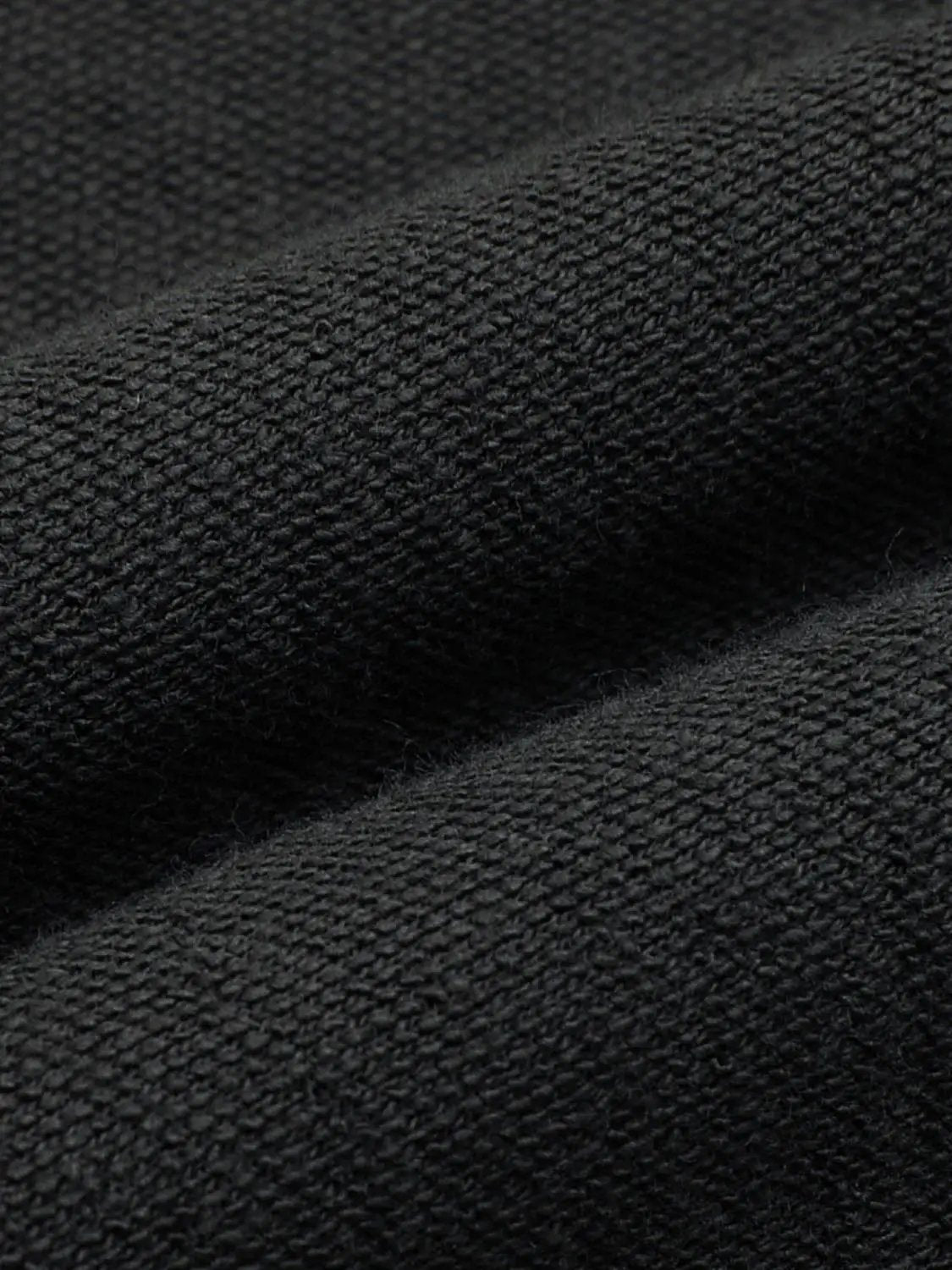 Elastic drawstring waist cotton-blend shorts in black fabric with close-up texture.