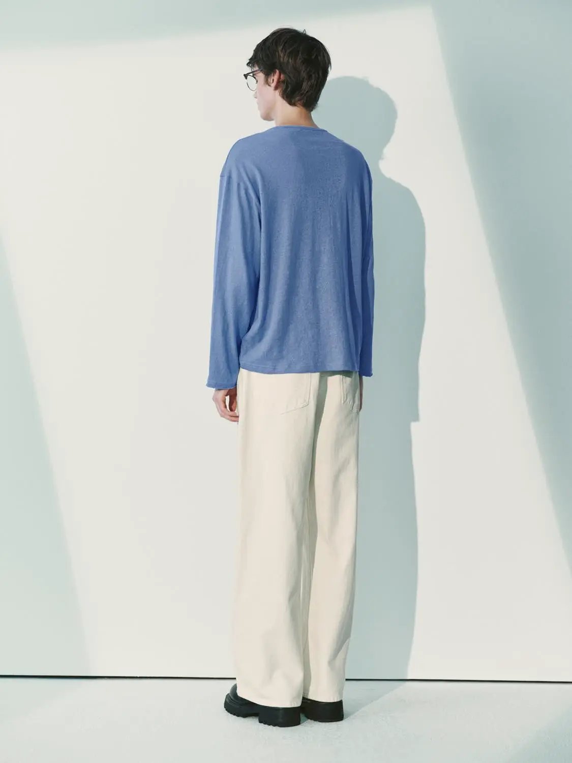 Jeans, beige wide-leg casual pants shown from back view