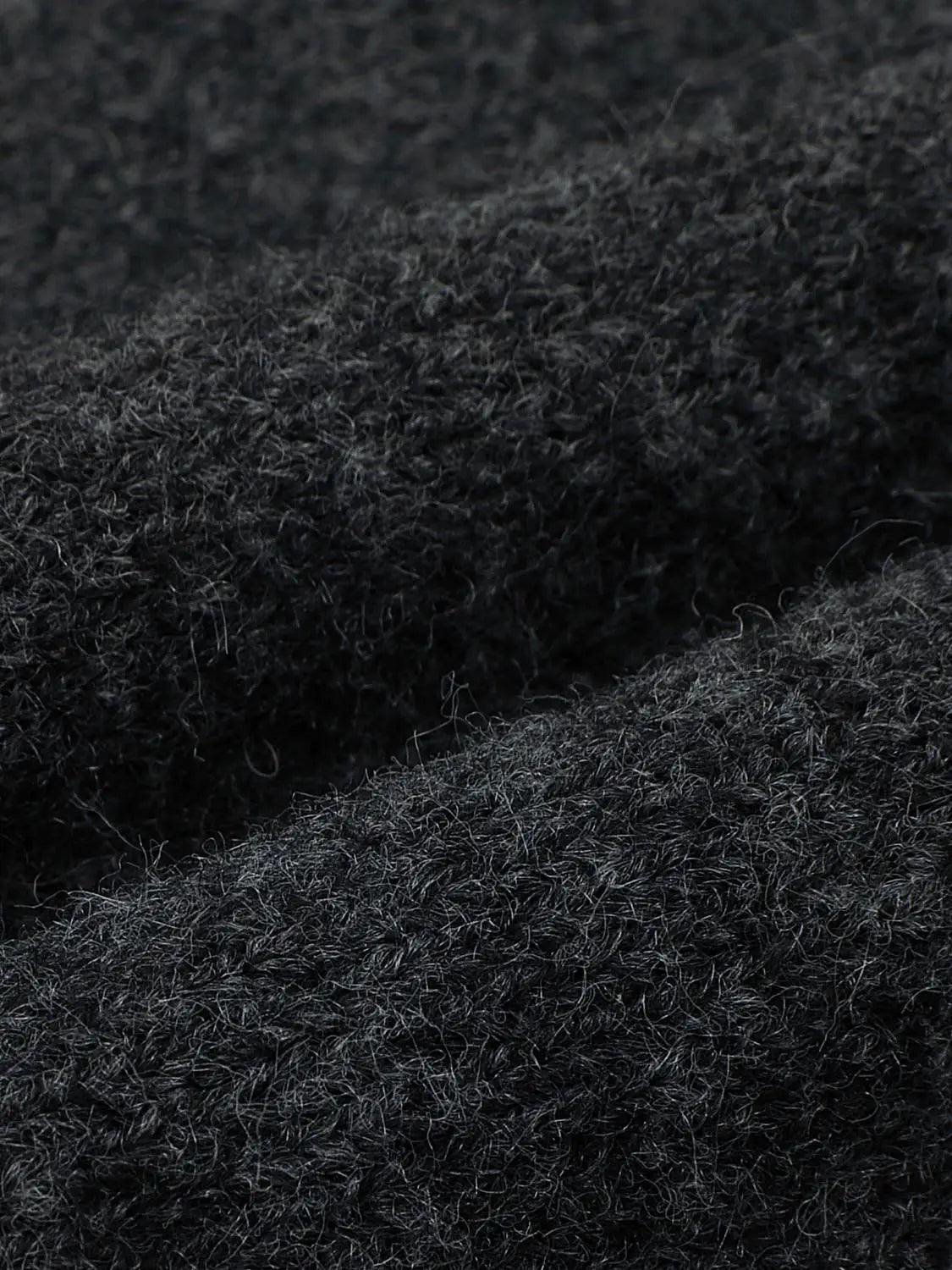 Knit T-Shirt fabric in dark charcoal, close-up of soft fuzzy knit texture.