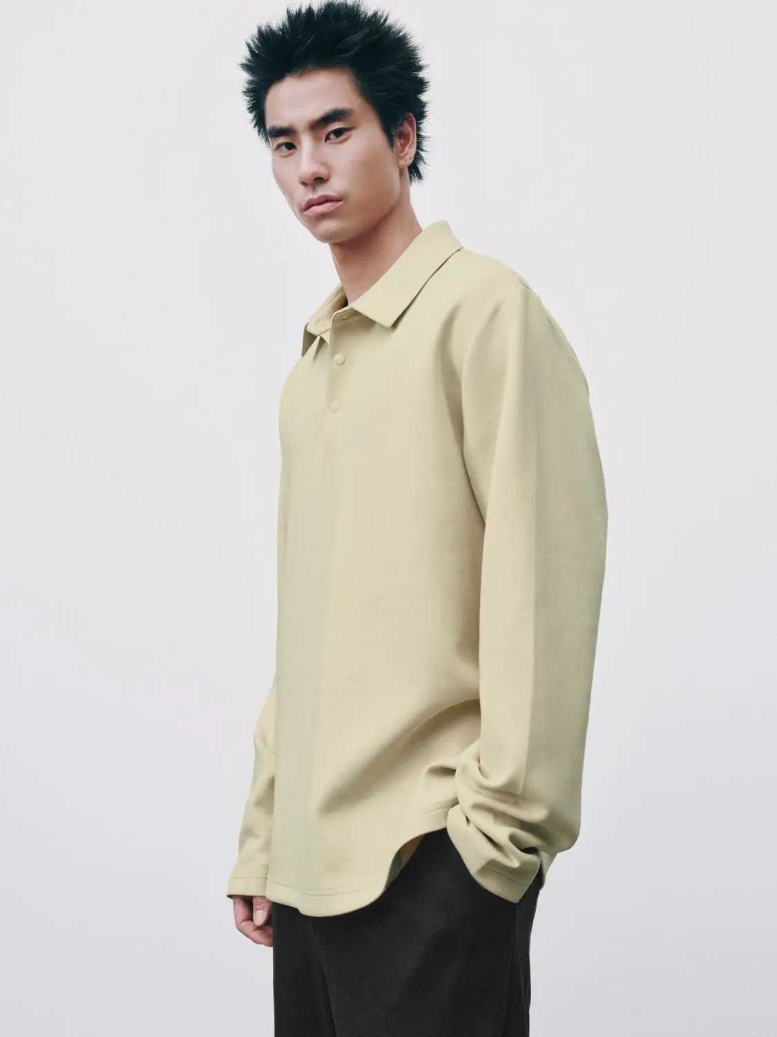 Polo shirt, beige long-sleeve with collar and button placket.