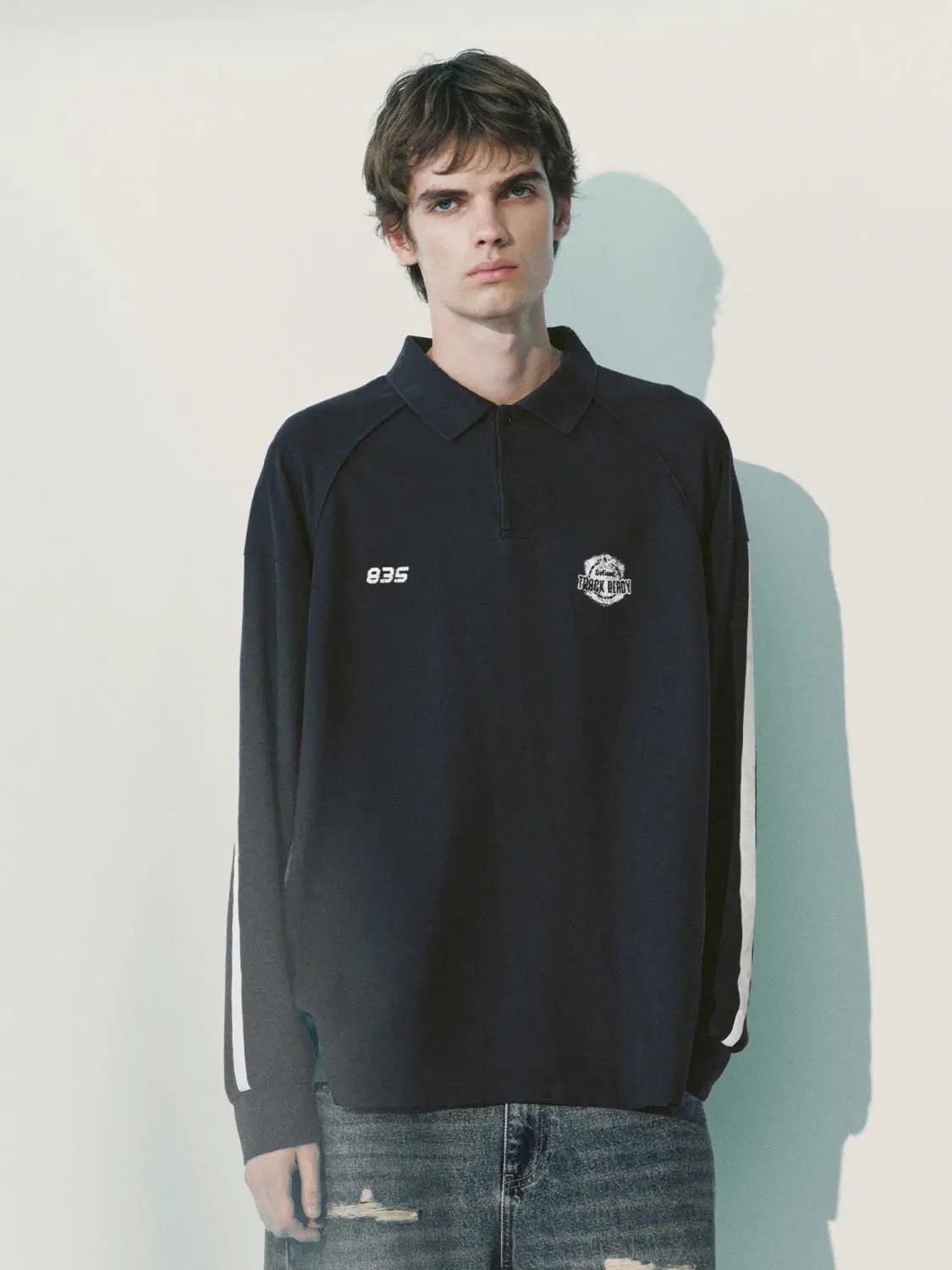 Polo shirt by Urban Revivo Fashion, navy with white sleeve stripes, left chest 835 embroidery and round logo.