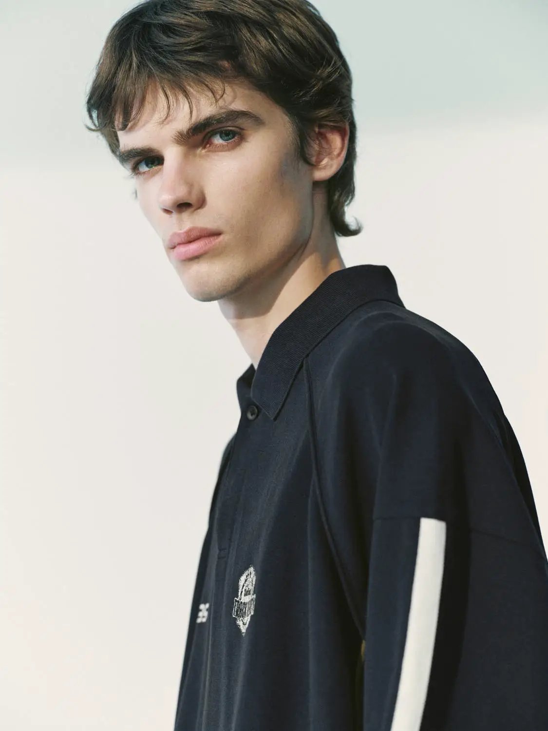 Polo shirt by Urban Revivo Fashion in navy with a white sleeve stripe.