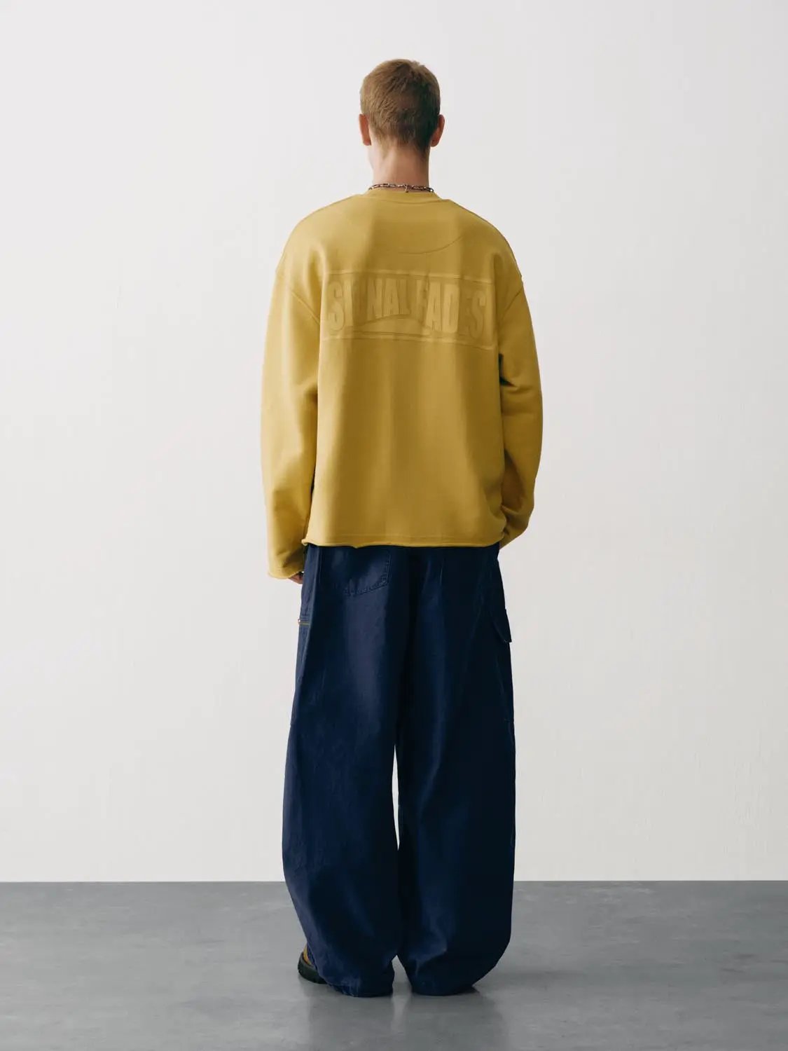 Sweatshirt by Urban Revivo, mustard yellow, oversized fit with subtle back logo.