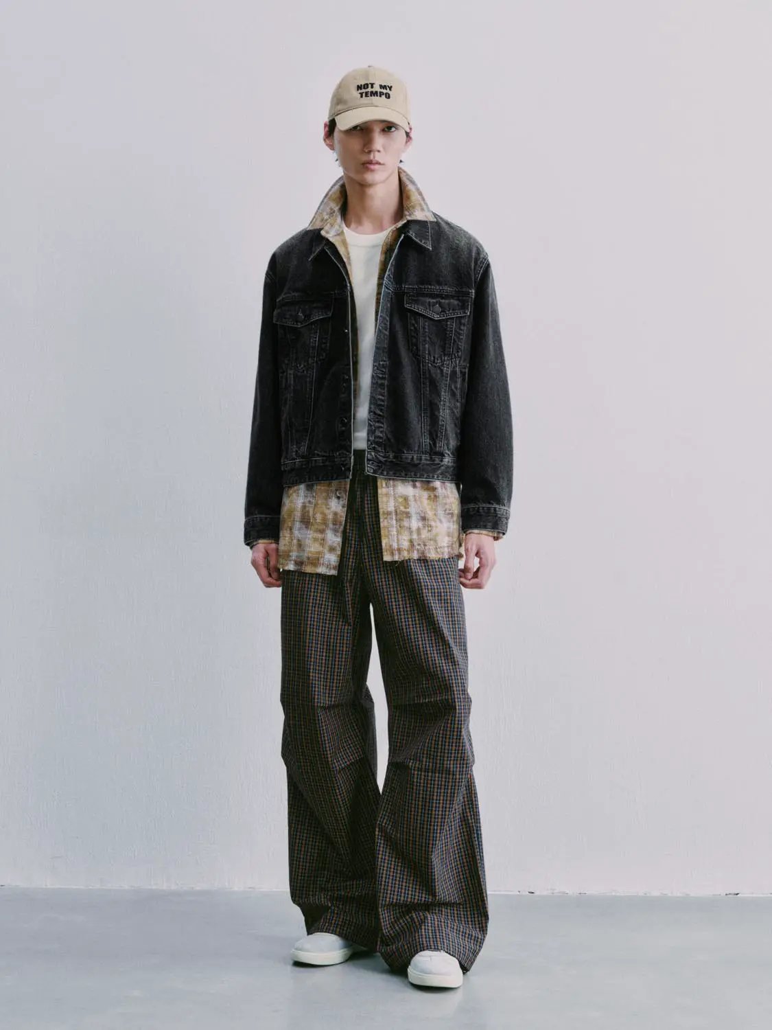 Denim jackets by Urban Revivo Fashion, black-washed denim layered over a beige plaid shirt.