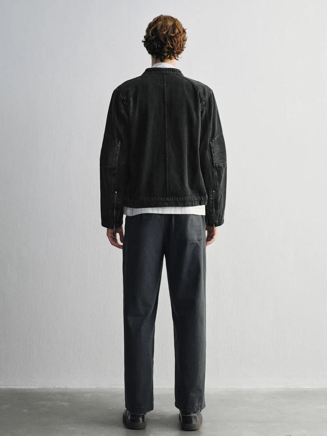 Denim jacket, black wash by Urban Revivo Fashion, back view with ribbed sleeve panels