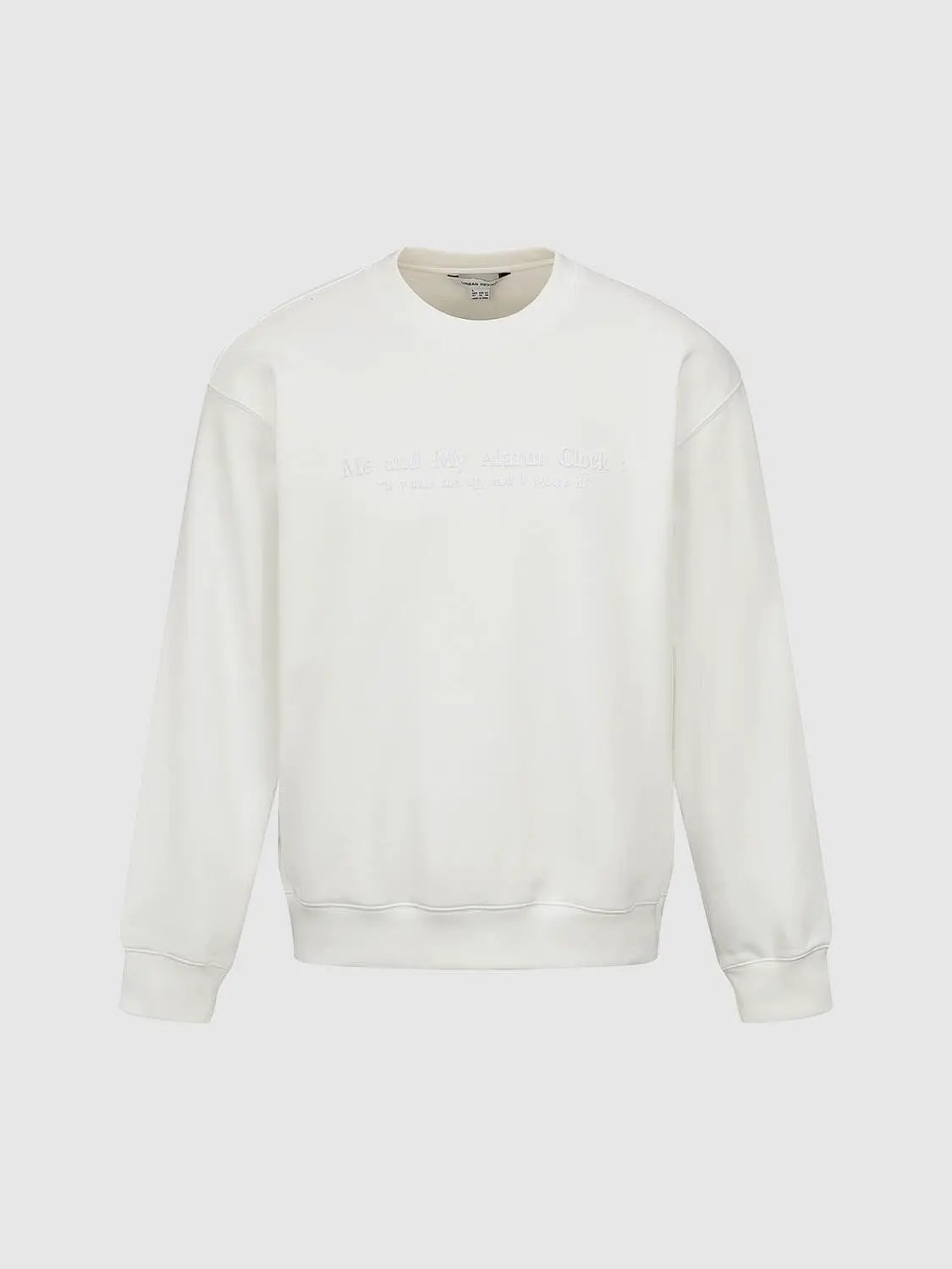 Sweatshirt; white crewneck with subtle white embroidery across chest; long sleeves.