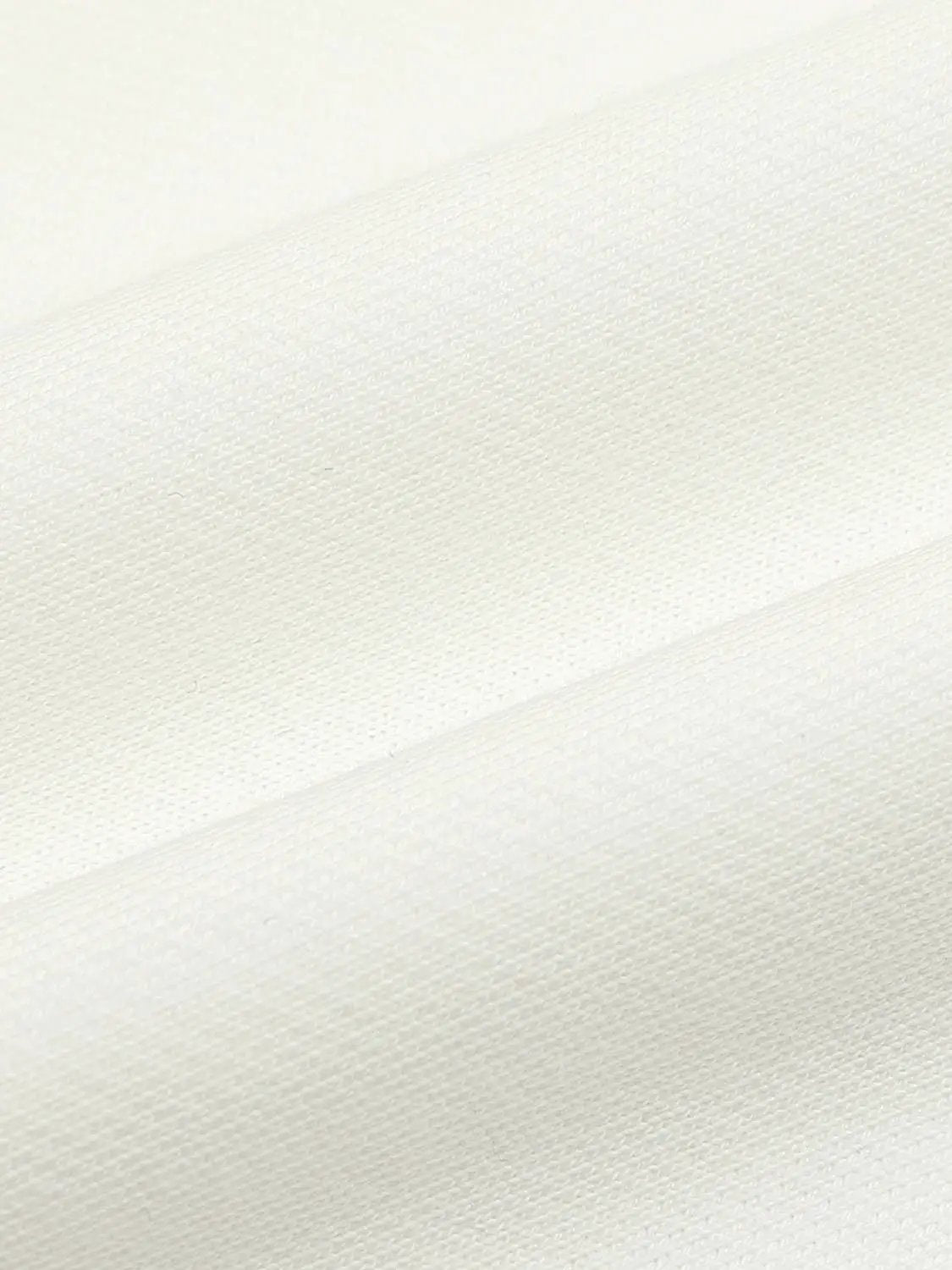 Sweatshirt fabric close-up in off-white knit texture