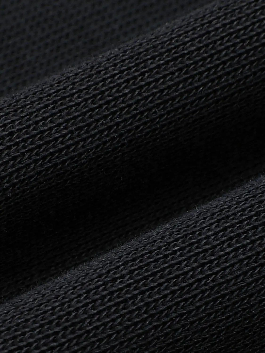 Sweatshirt by Urban Revivo Fashion; black knitted fabric close-up