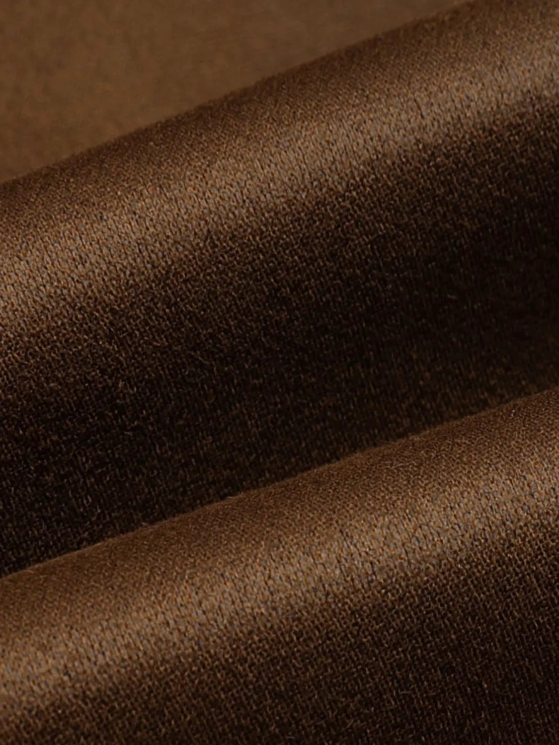 Trench coat Urban Revivo Fashion in brown textured fabric close-up