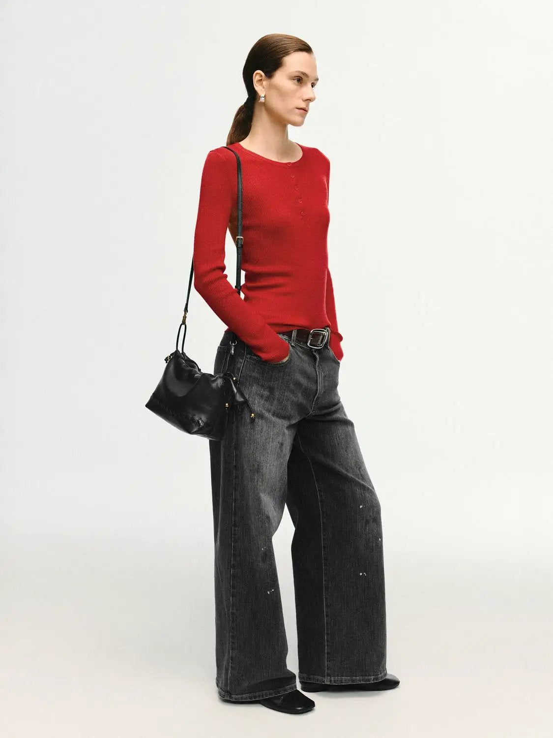 Slim Ribbed Button Front Long Sleeve T-Shirt in red; model wearing dark wide-leg jeans and a black crossbody bag