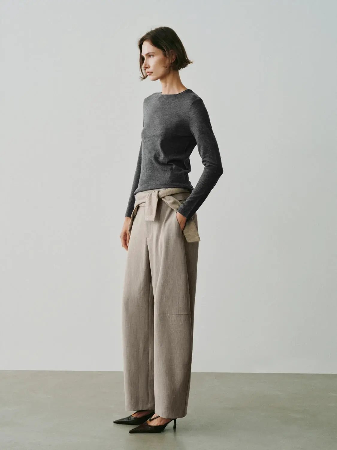 Knit T-Shirt by Urban Revivo Fashion in charcoal gray, worn with beige wide-leg trousers