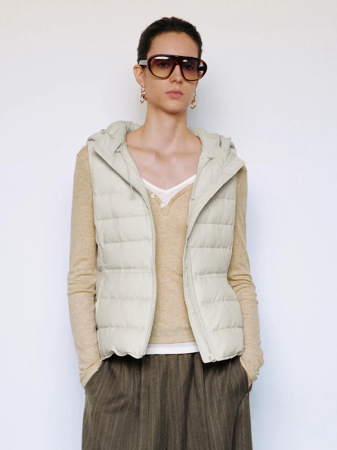 Down jacket vest in light beige, quilted puffer with hood, Urban Revivo Fashion.