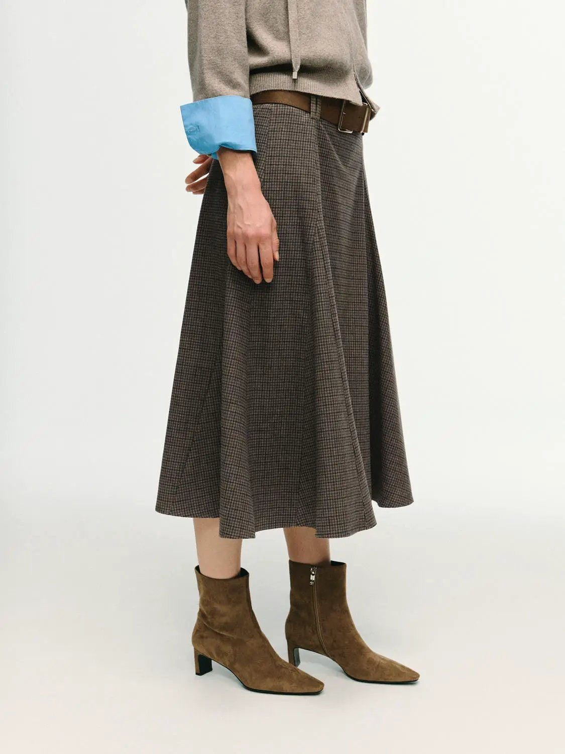 Checked mid-rise belted A-line midi skirt in brown plaid.