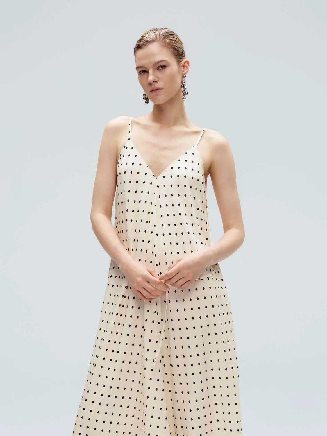 Polka Dot Strappy V-Neck A-Line Midi Dress in cream with black polka dots, thin spaghetti straps.