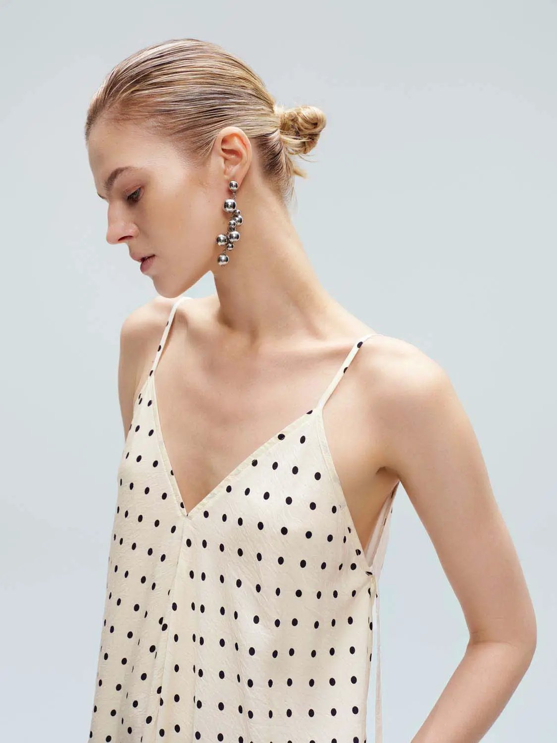 Polka Dot Strappy V-Neck A-Line Midi Dress in cream with black dots.