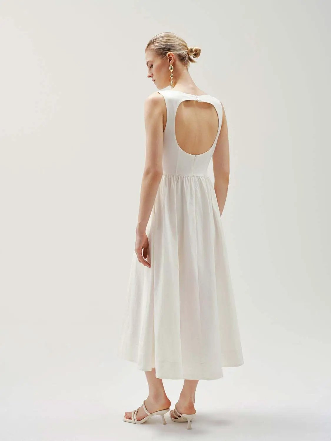Crepe open-back sleeveless A-line midi dress in white.