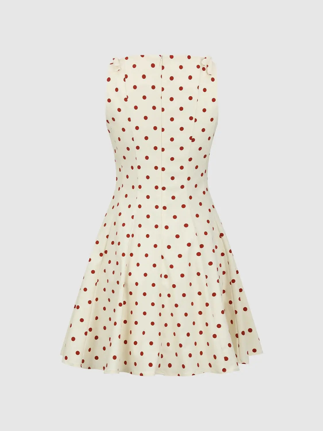 A-line dress in ivory with red polka dots, sleeveless with small shoulder ruffles