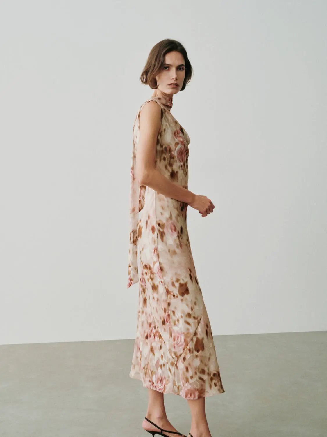 Soft Romantic Floral Print H-line Maxi Dress in beige with pink and brown florals, worn by a model.