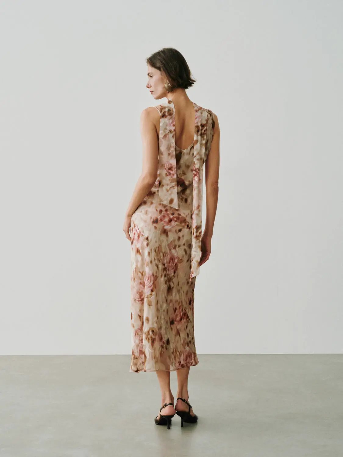 Soft Romantic Floral Print H-line Maxi Dress by Urban Revivo Fashion, sleeveless with open back and tie, beige-pink.