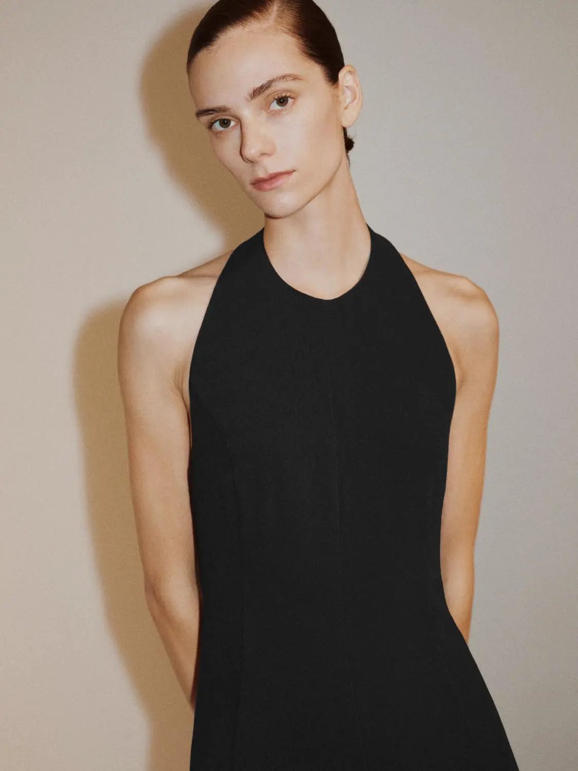 Fitted high-neck sleeveless A-line maxi dress in black