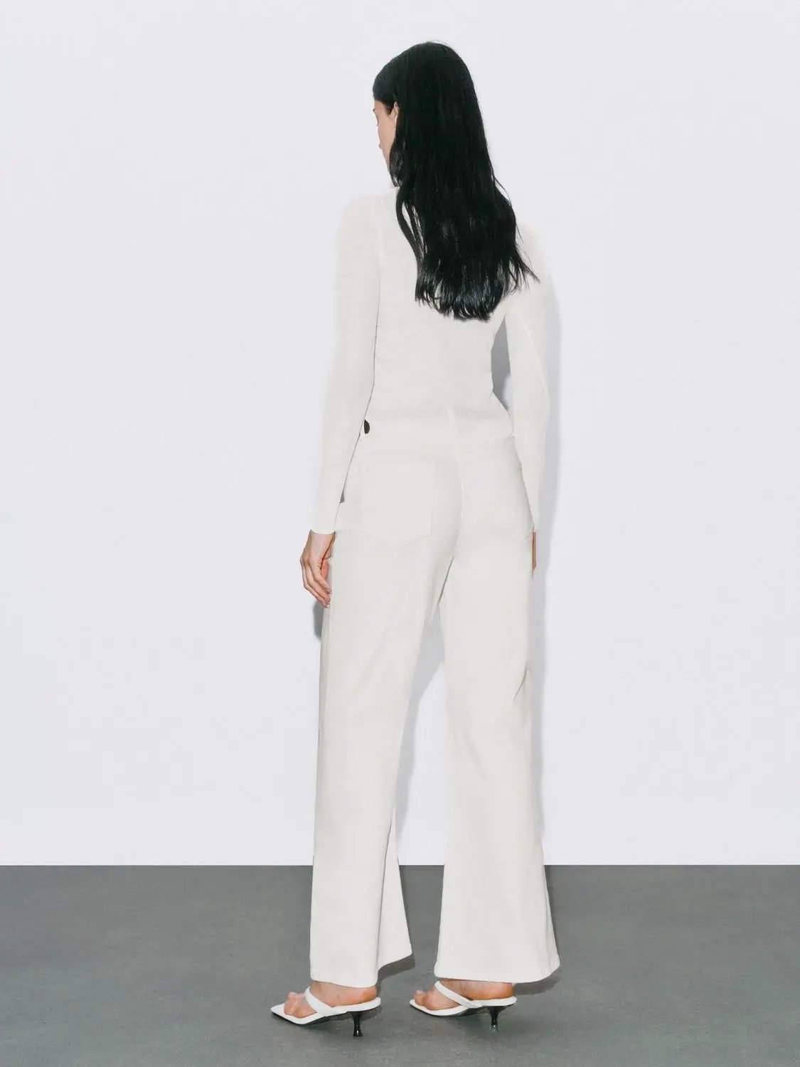 Mid Rise Belt Loop Cotton Stretch Flared Jeans in white, back view with belt loops, rear pockets and seam detailing