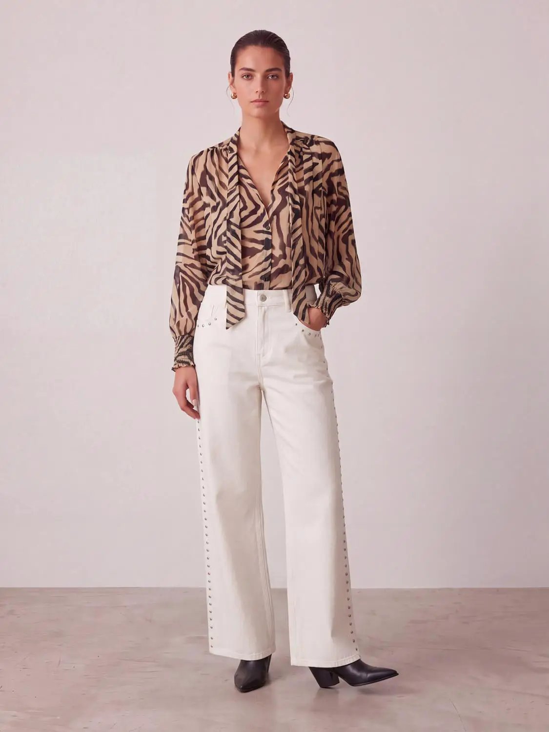 Women's white cotton high-waist wide-leg jeans with studded side seams by Urban Revivo Fashion