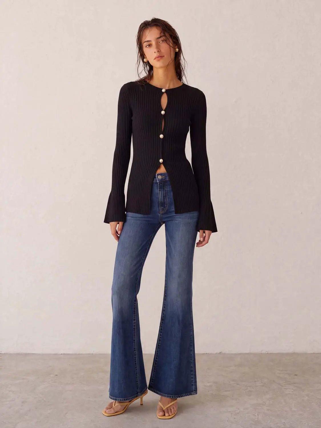 Skinny knitted cardigan by Urban Revivo Fashion in black ribbed knit with pearl buttons and bell sleeves
