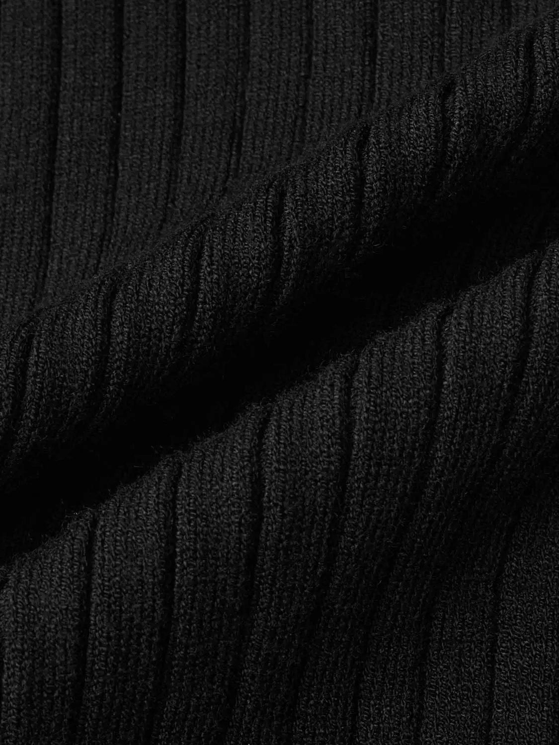 Skinny knitted cardigans close-up fabric in black with ribbed knit texture