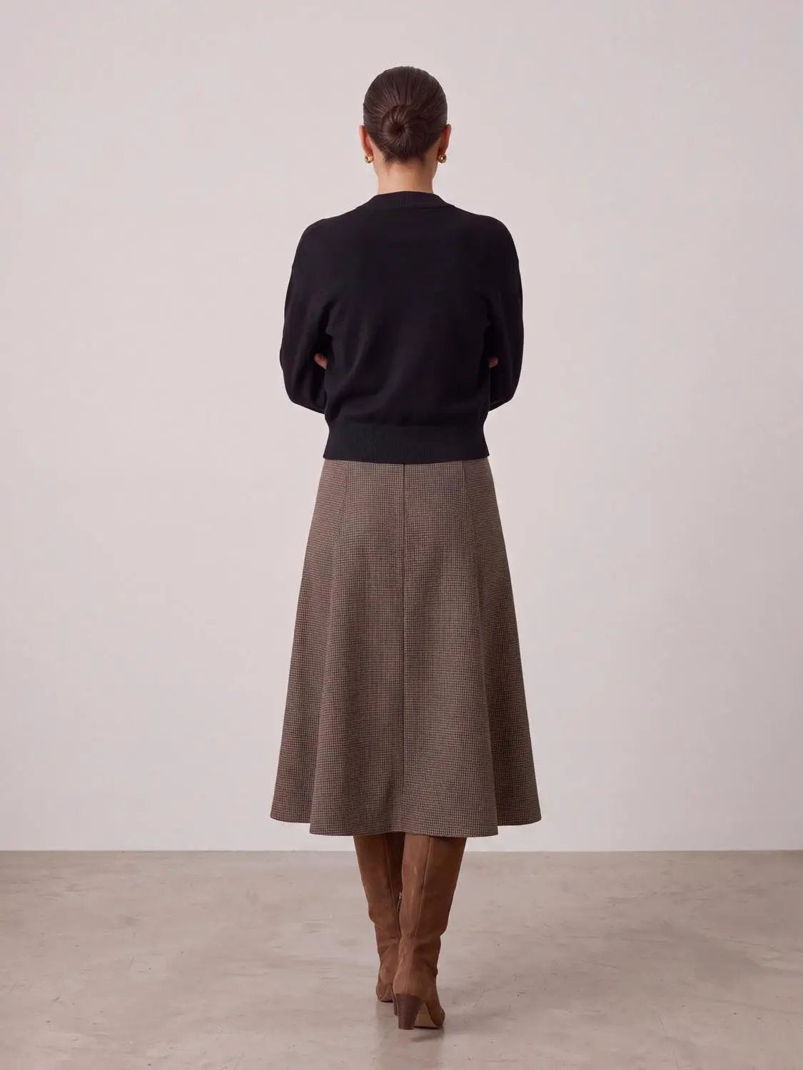 Cut-Out Long Sleeve Knitted T-Shirts black knit top on model back view; brown check midi skirt and knee-high boots