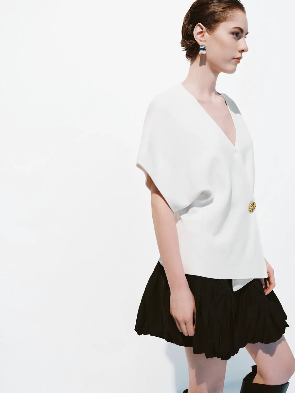 Wrap V-Neck Batwing Short Sleeve Knitted Cardigan in white by Urban Revivo Fashion, worn by model with gold button.