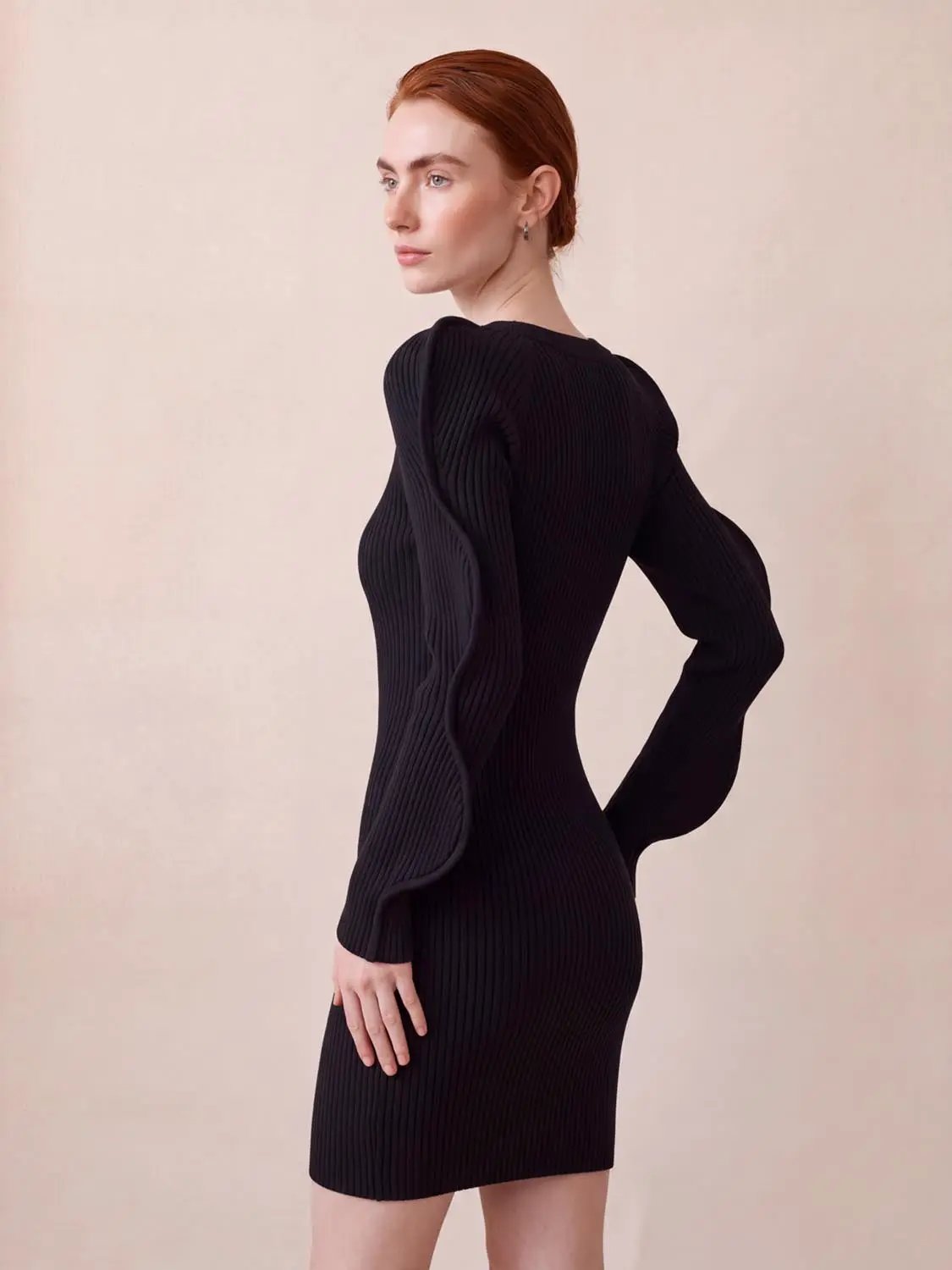 Wave Sleeve Knitted Midi Dress in black with ribbed texture and dramatic long sleeves