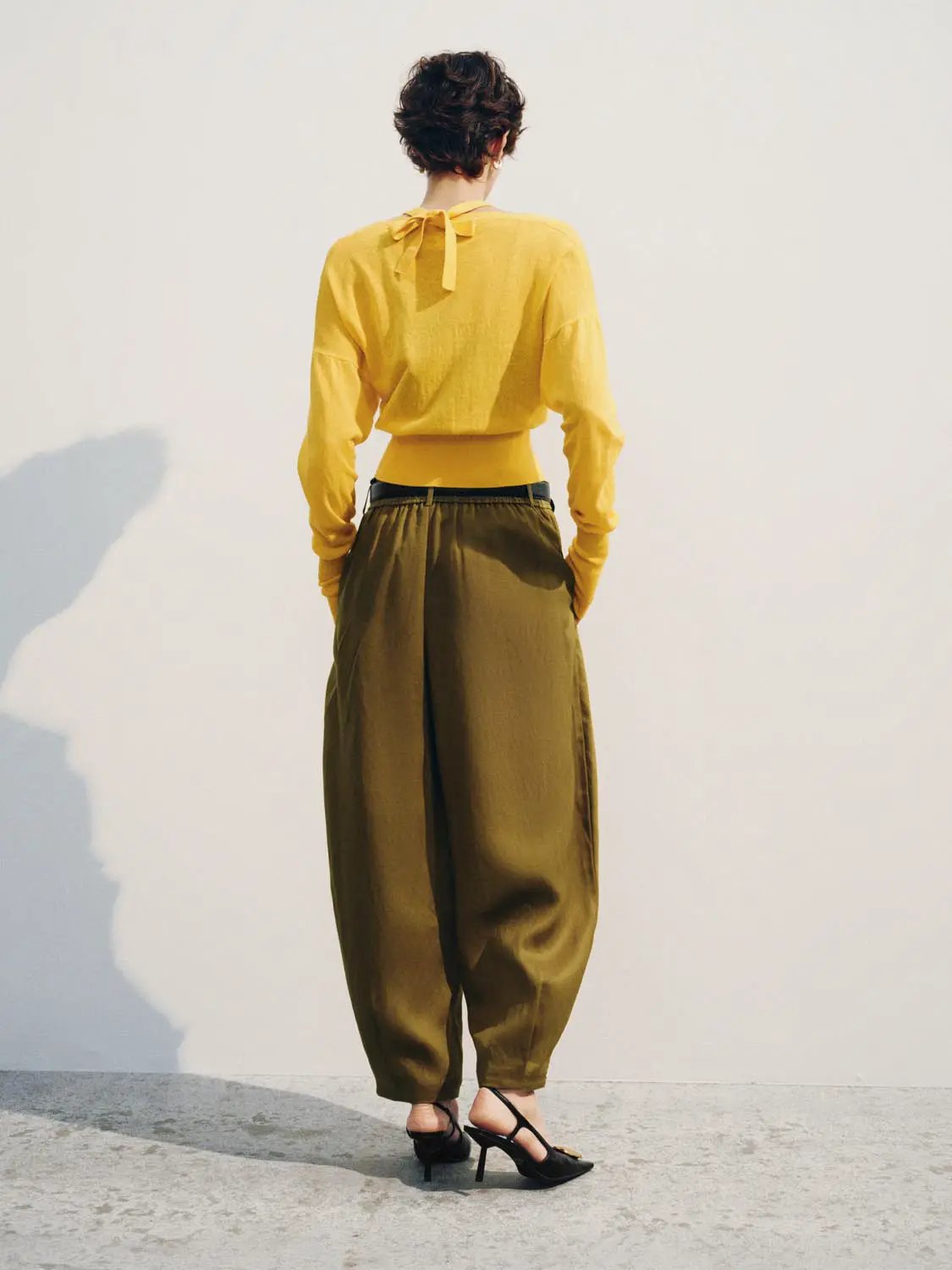 Tie Neck Cotton Long Sleeve Cardigan in yellow; paired with olive wide-leg pants