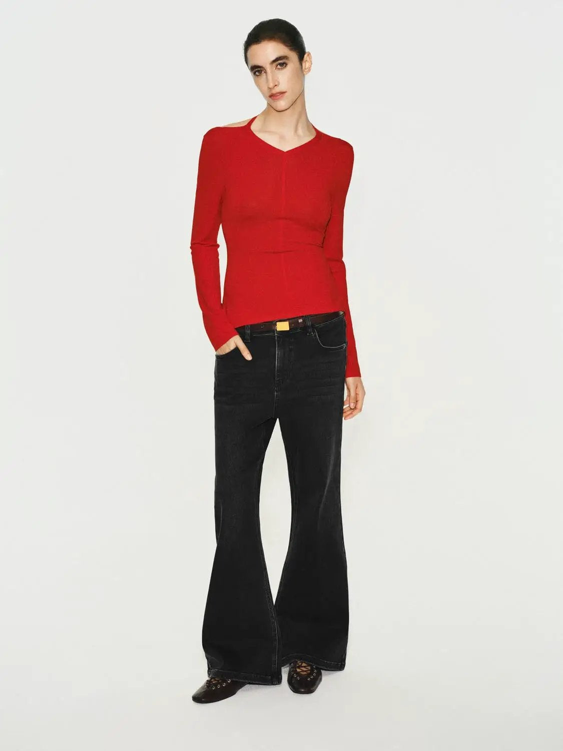 Solid red fitted long-sleeve V-neck knit T-shirt worn with black wide-leg jeans