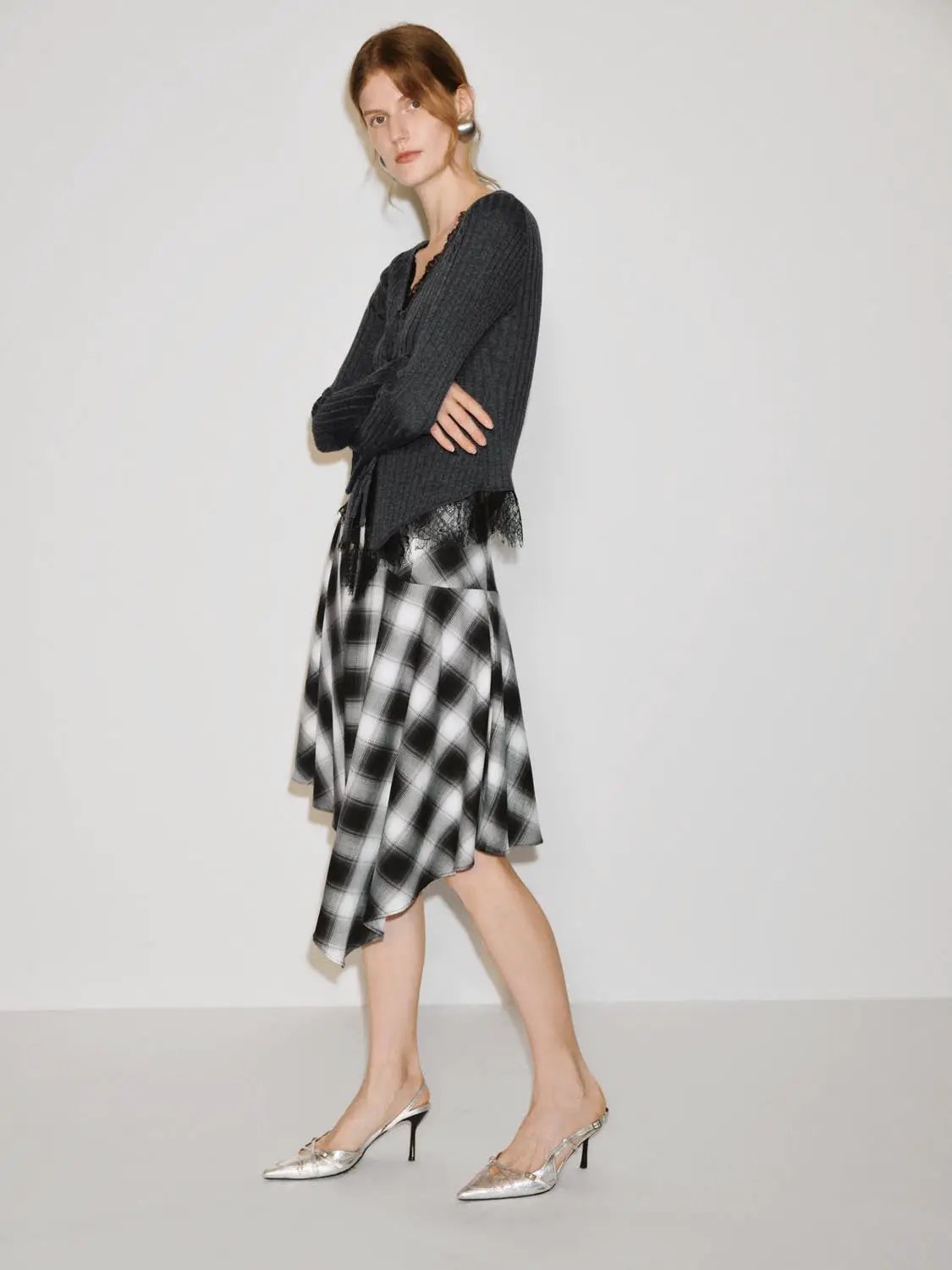 Knitted sweater by Urban Revivo Fashion: dark gray knit with lace hem; 3-piece plaid midi outfit with silver heels