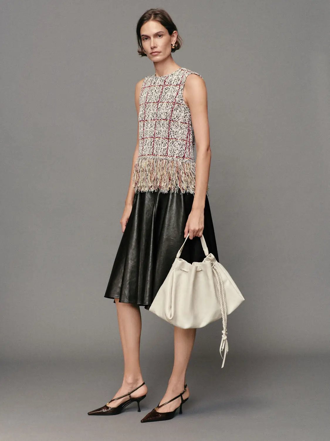 Checked fringe-hem crew-neck sleeveless knit top in cream plaid with red grid by Urban Revivo Fashion.
